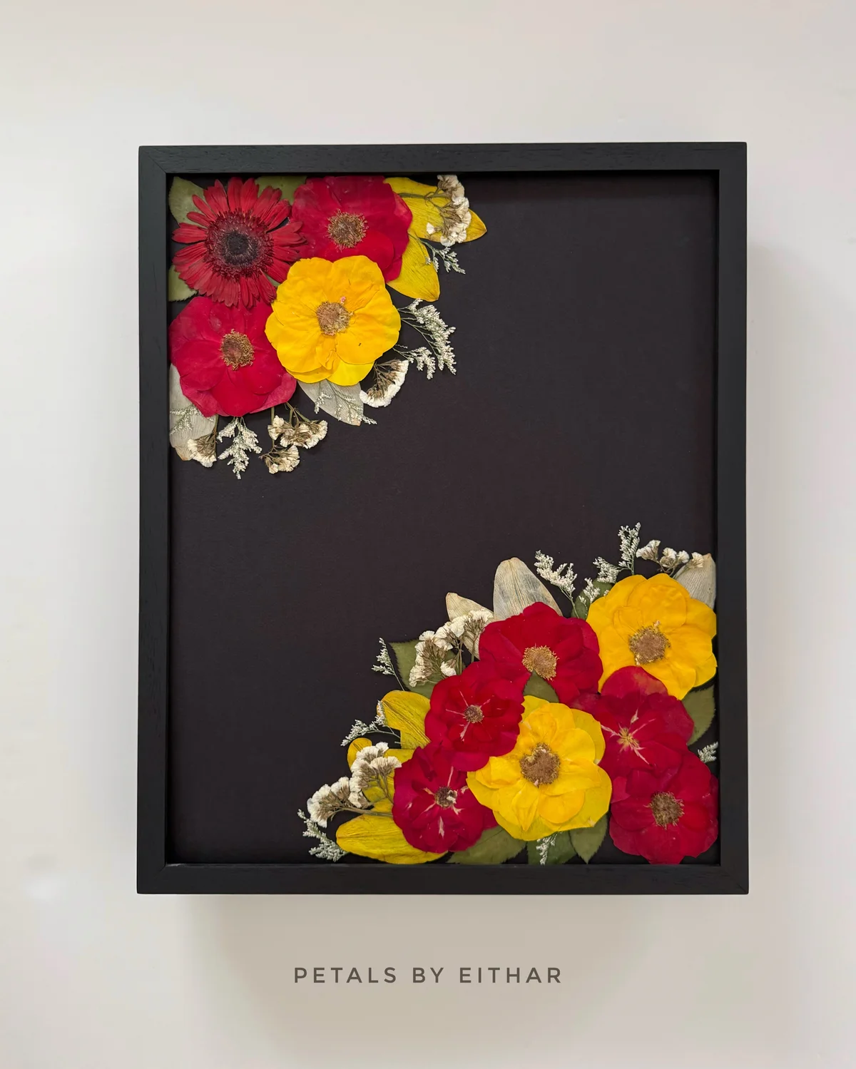Red and yellow blooms in a dark frame